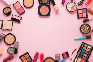 Free Photo | Different cosmetics types scattered on pink table